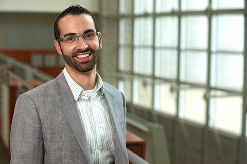 Daniel Coyle poses by a window