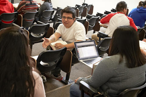 students talk in class