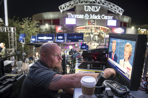 CNN technician Shawn Flowers watches the debate from the media gallery