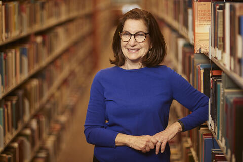 woman posing in library