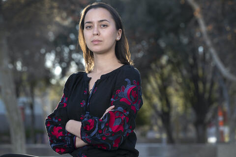 UNLV student Mary Blankenship poses for a photo on campus wearing a vyshyvanka, a traditional embroidered Ukrainian blouse