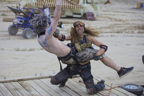 still from film of fight scene between a woman and a man