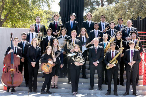 jazz ensemble posing with instruments