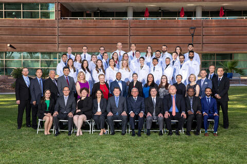 group photo of residents on lawn