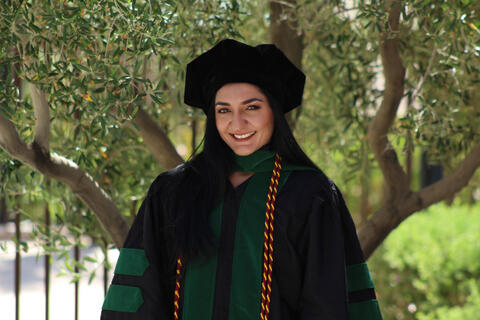 woman in commencement regalia