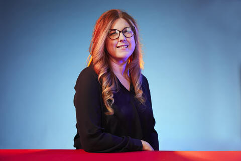 woman posing with colorful lighting