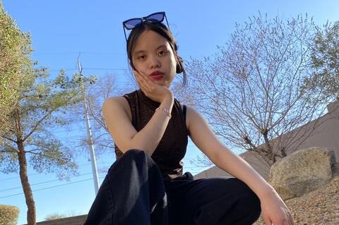 Mary poses in an all black outfit.