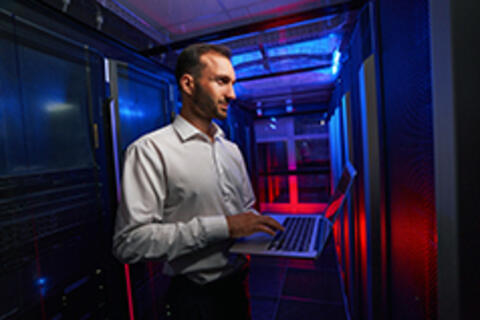 man holding laptop in hands