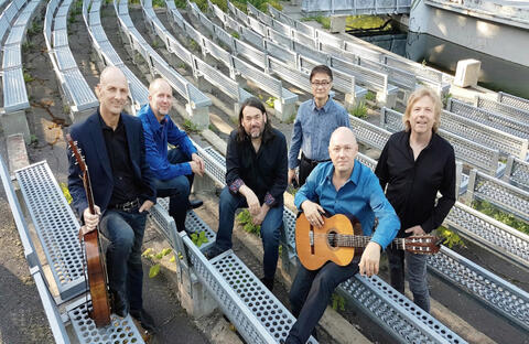 group of musicians with guitars