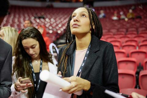 Jade Thomas looks up as she prepares for a live news broadcast