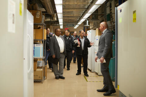 large group on walkthrough of building