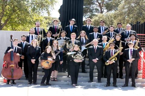orchestra members all posing outside