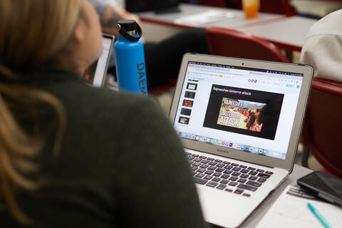 laptop screen with coursework titled "Bioterror Attack"