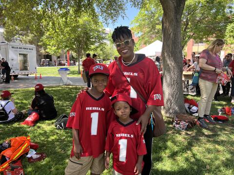 children wearing a red jersey outdoors
