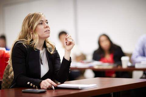 woman learning in a classroom setting
