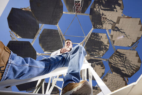 man working with mechanical engineering equipment outside