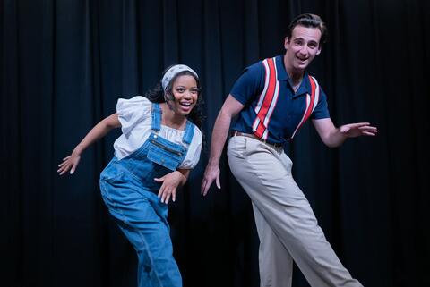 two performers dancing on stage