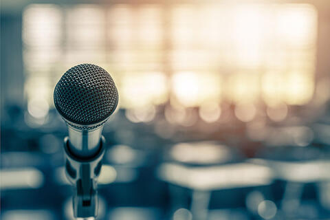 A microphone in focus while the background is blurred