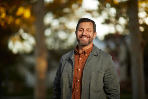 closeup of ombud david schwartz outside near trees