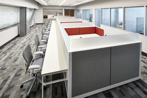 photo of a long table with office chairs and cubes