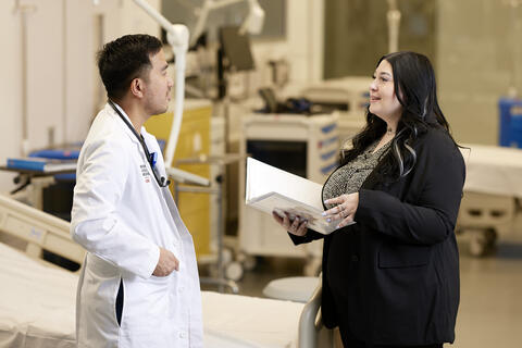 two people discussing together