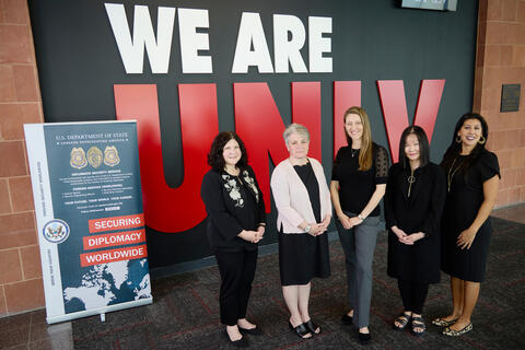 individuals involved in collaboration pose for photo