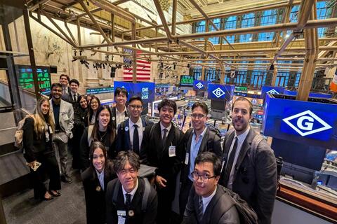 business school students visiting the NYC stock exchange