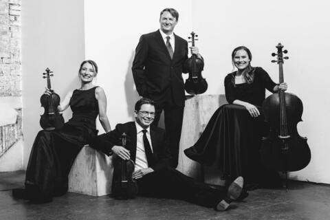 four musicians with instruments