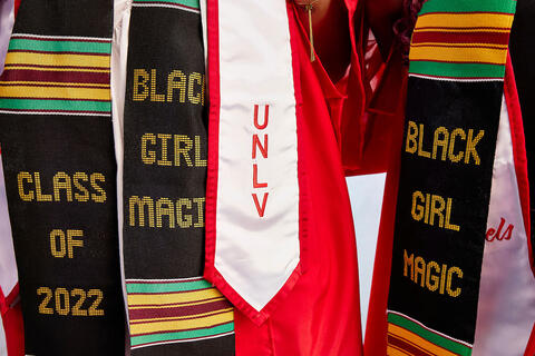 graduation stoles with the words "U-N-L-V", "Class of 2022", and "Black Girl Magic"