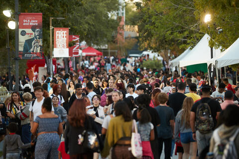 crowd of people on UNLV campus surrounded by booths