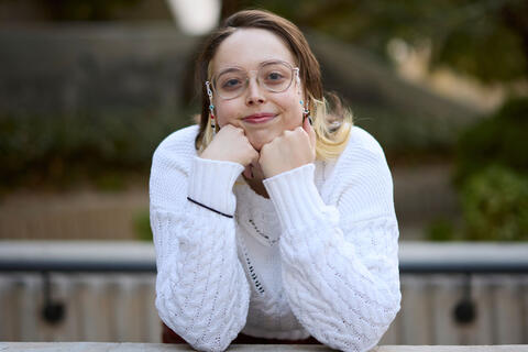 woman posing with her chin in her hands