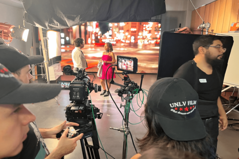 students filming behind the scenes