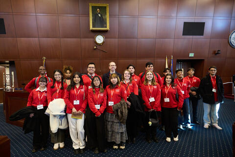 group of students in red shirts inside Nevada legislature