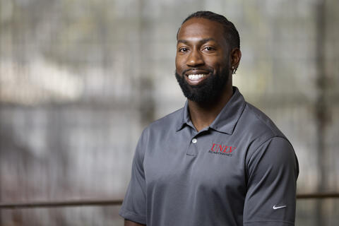 Cordero Roche wearing a UNLV polo shirt