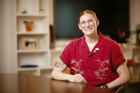 Kass Moore in bright red shirt