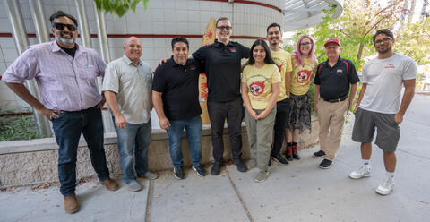 Students and Alumni posing for a picture