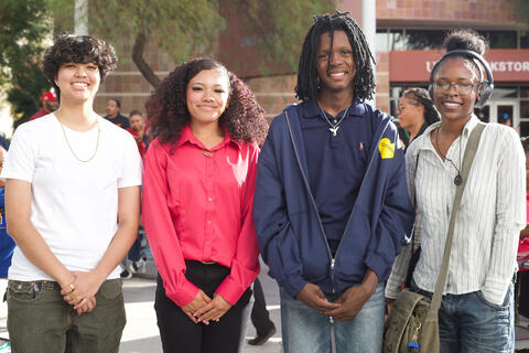 Four high school students posed for a group photo