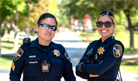 Two University Police officers posing at the U-N-L-V campus
