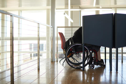 a student studying at a wheelchair accessible desk in Greenspun