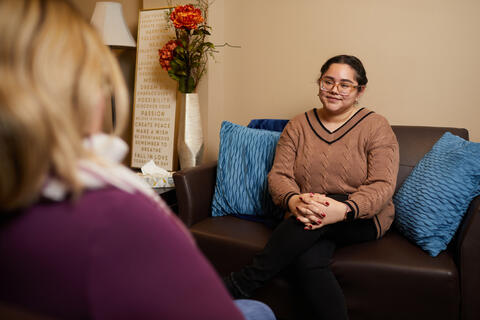 A person sitting on a couch