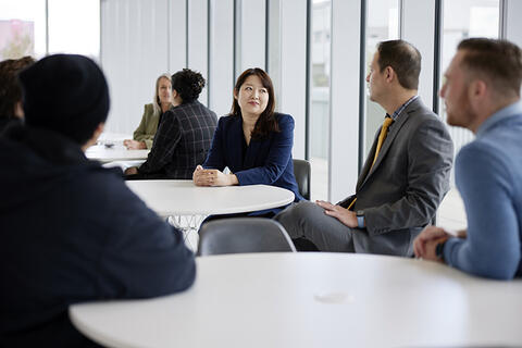 People wearing suits and sitting