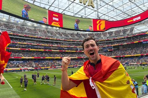 Manolo Vazquez wearing Spain's flag during 2026 FIFA World Cup game