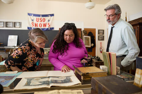 Person looking at a large book