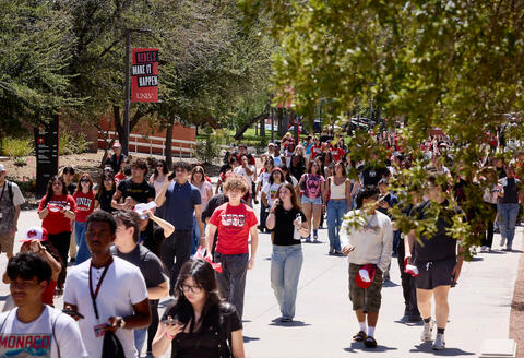Students and staff walking around campus
