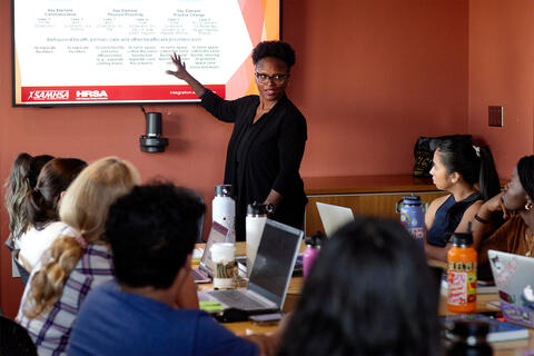 Professor lecturing to a group of students