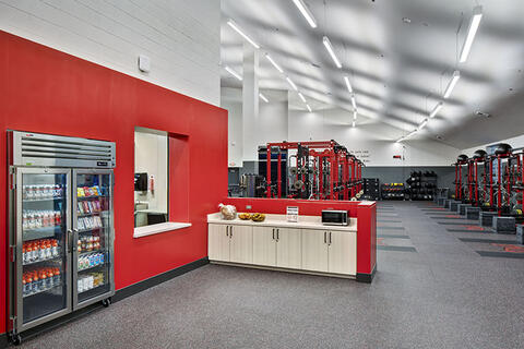 lounge area at a gym building with a vending machine