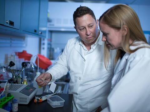 Two professors working in a lab.