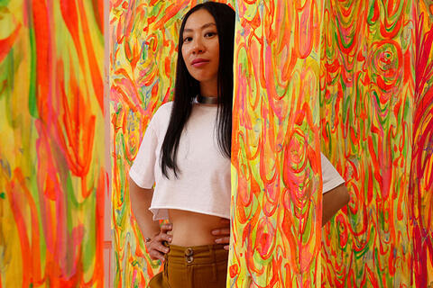 Girl posing in art exhibit