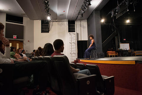 Audience sitting down in a theatre
