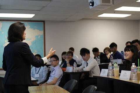 A woman speaking in a classroom